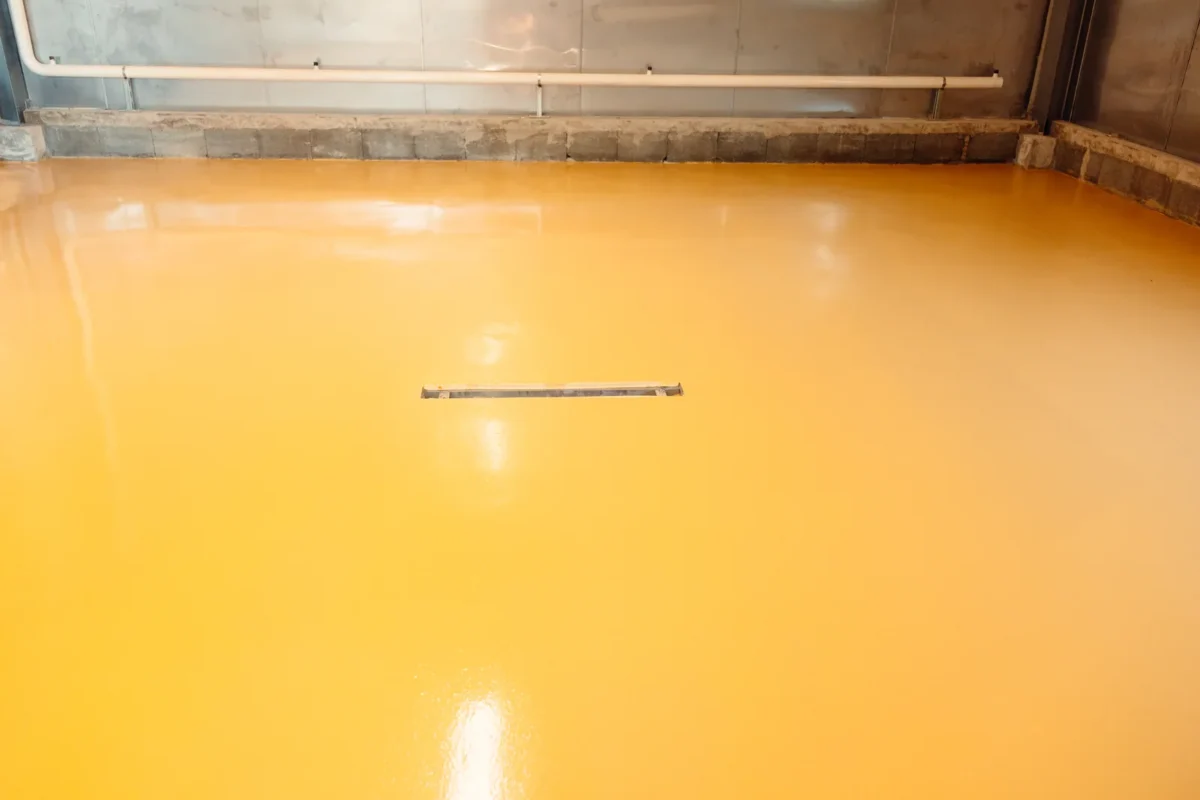 Drainage channel set into a yellow resin factory floor
